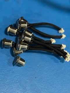 Close-up of braided wire harness pigtails with connectors